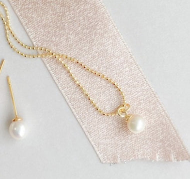 Peace Pearl Necklace by eLiasz and eLLa
