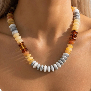 Model wearing the yellow Sunshine Social Marble Bead Necklace